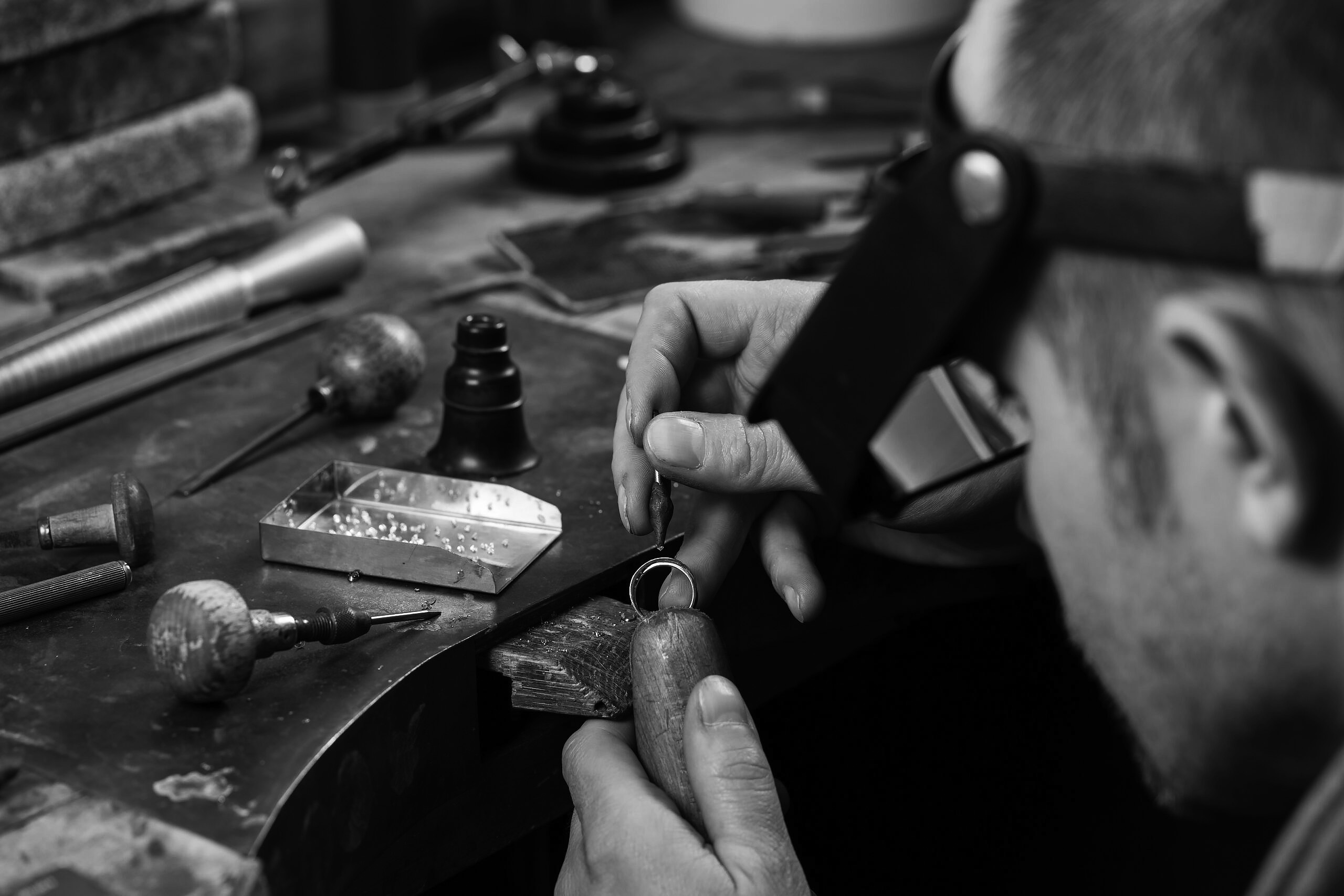 Craft jewelery making. Ring repairing. Putting the diamond on the ring.